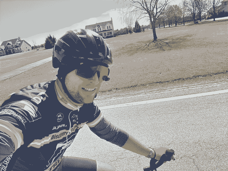 Selfie of Alex riding a bike